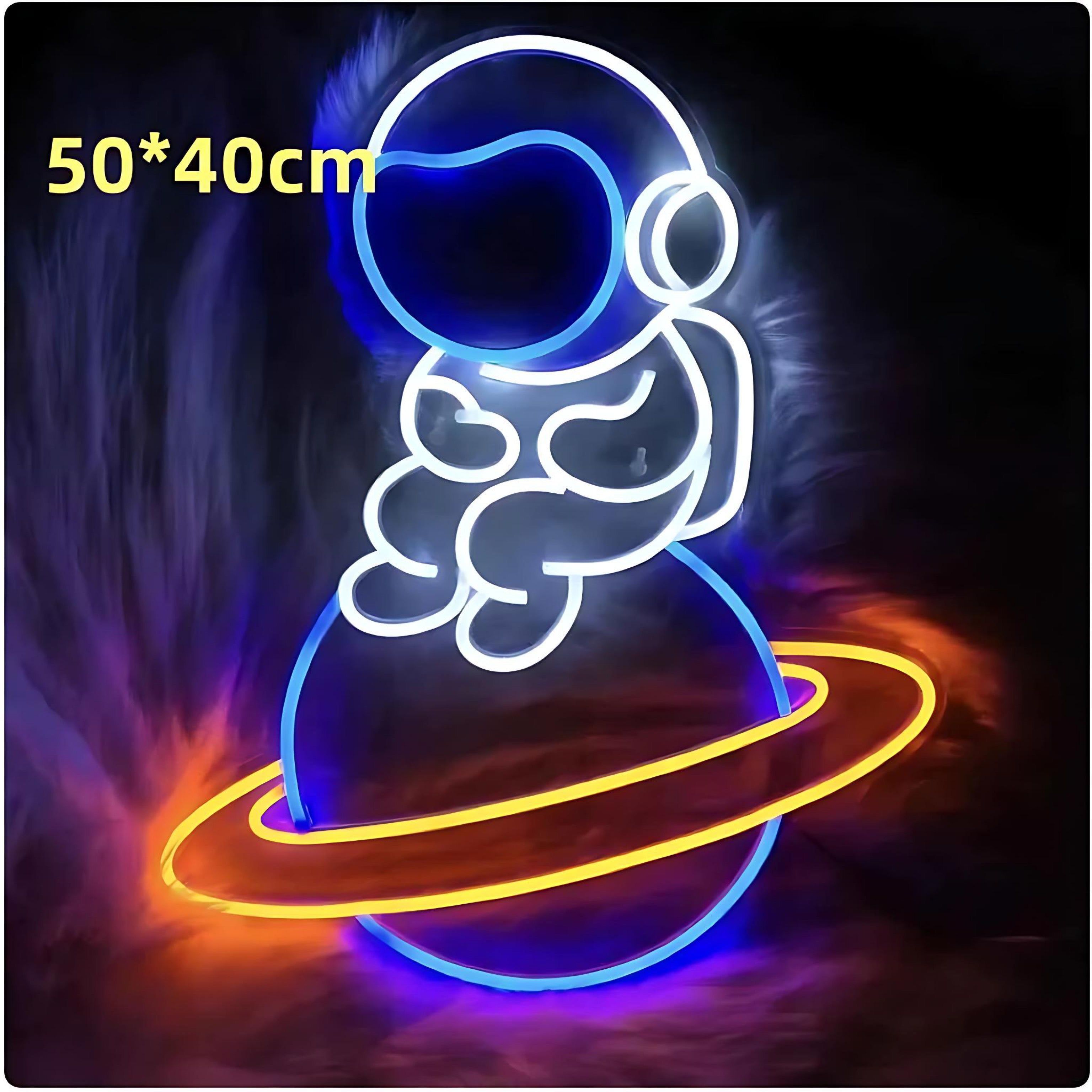 Neon astronaut sitting on glowing planet in orange and blue lights