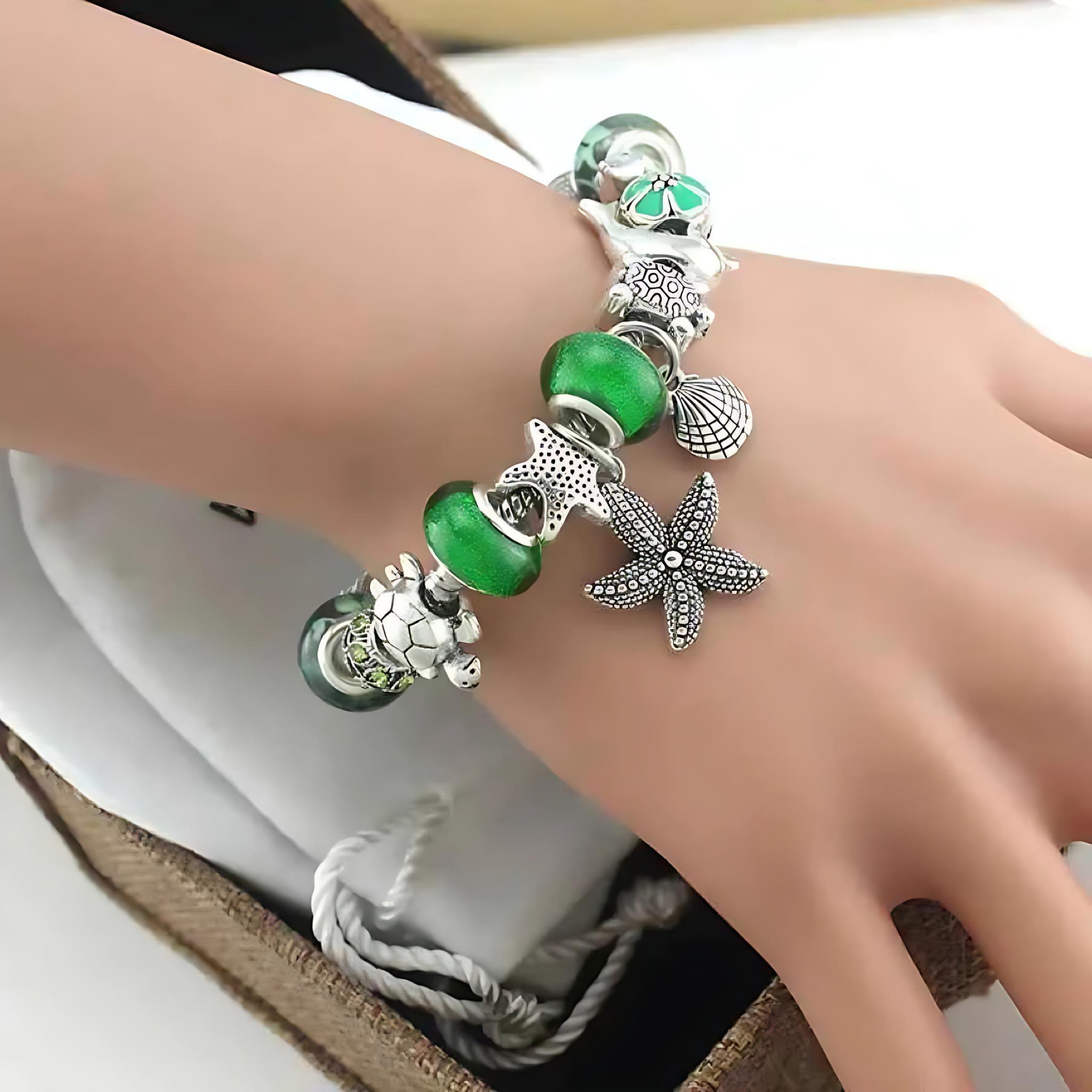Ocean Series Green Glass Bead Bracelet – Dolphin, Shell & Starfish Charms by Wave & Hang