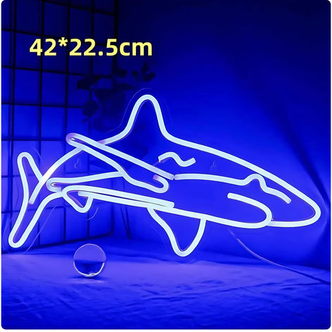 Blue neon light shaped like a shark with measurements displayed