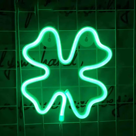 Green neon LED light shaped like a four leaf clover