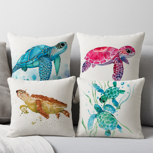 Set of 4 sea turtle cushion covers – blue, pink, golden, and green watercolor turtle designs on decorative pillows arranged on a grey sofa.
