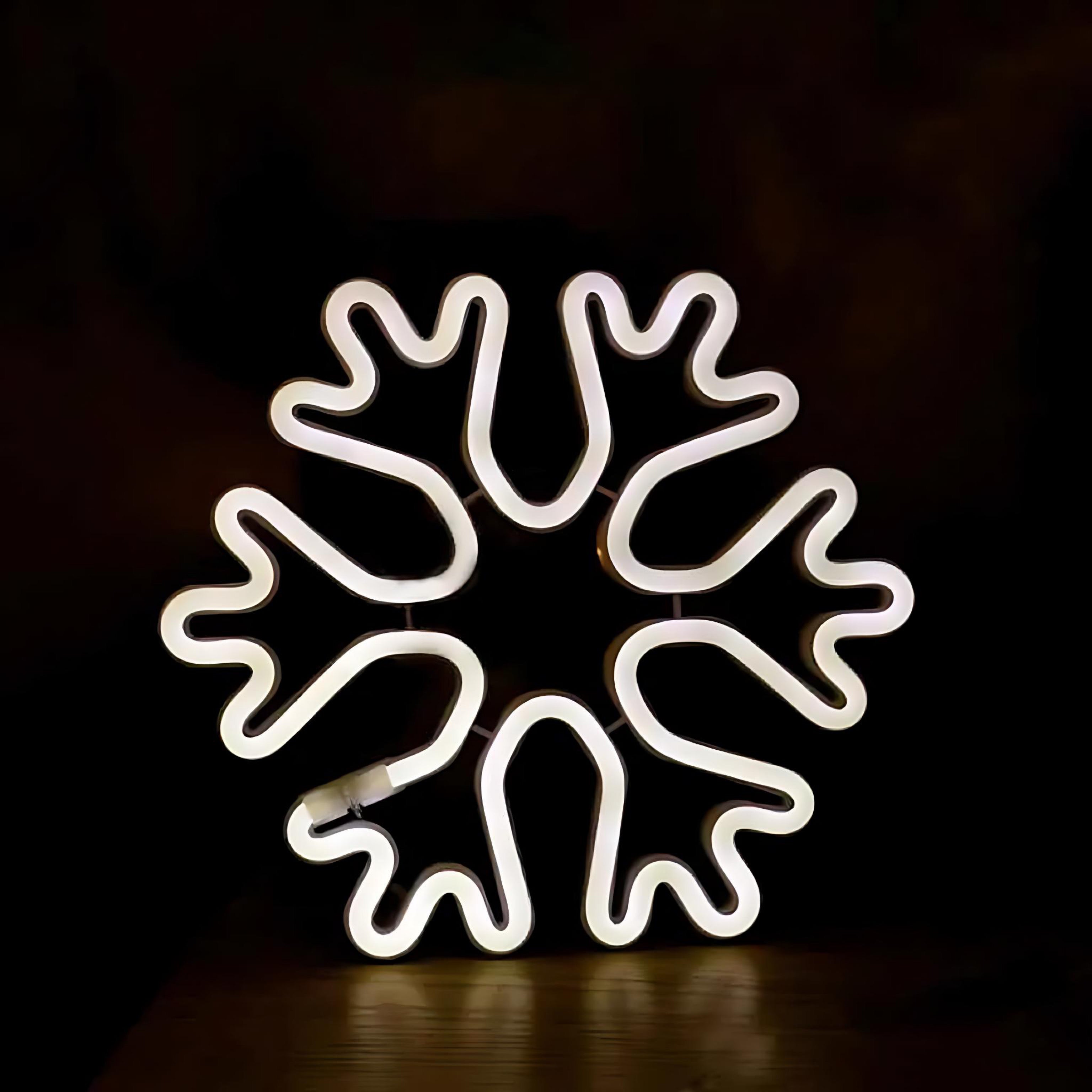 White neon snowflake shaped wall light