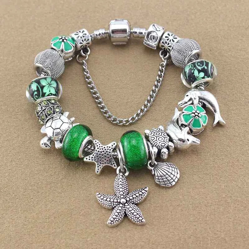 Ocean Series Green Glass Bead Bracelet – Dolphin, Shell & Starfish Charms