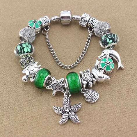 Ocean Series Green Glass Bead Bracelet – Dolphin, Shell & Starfish Charms