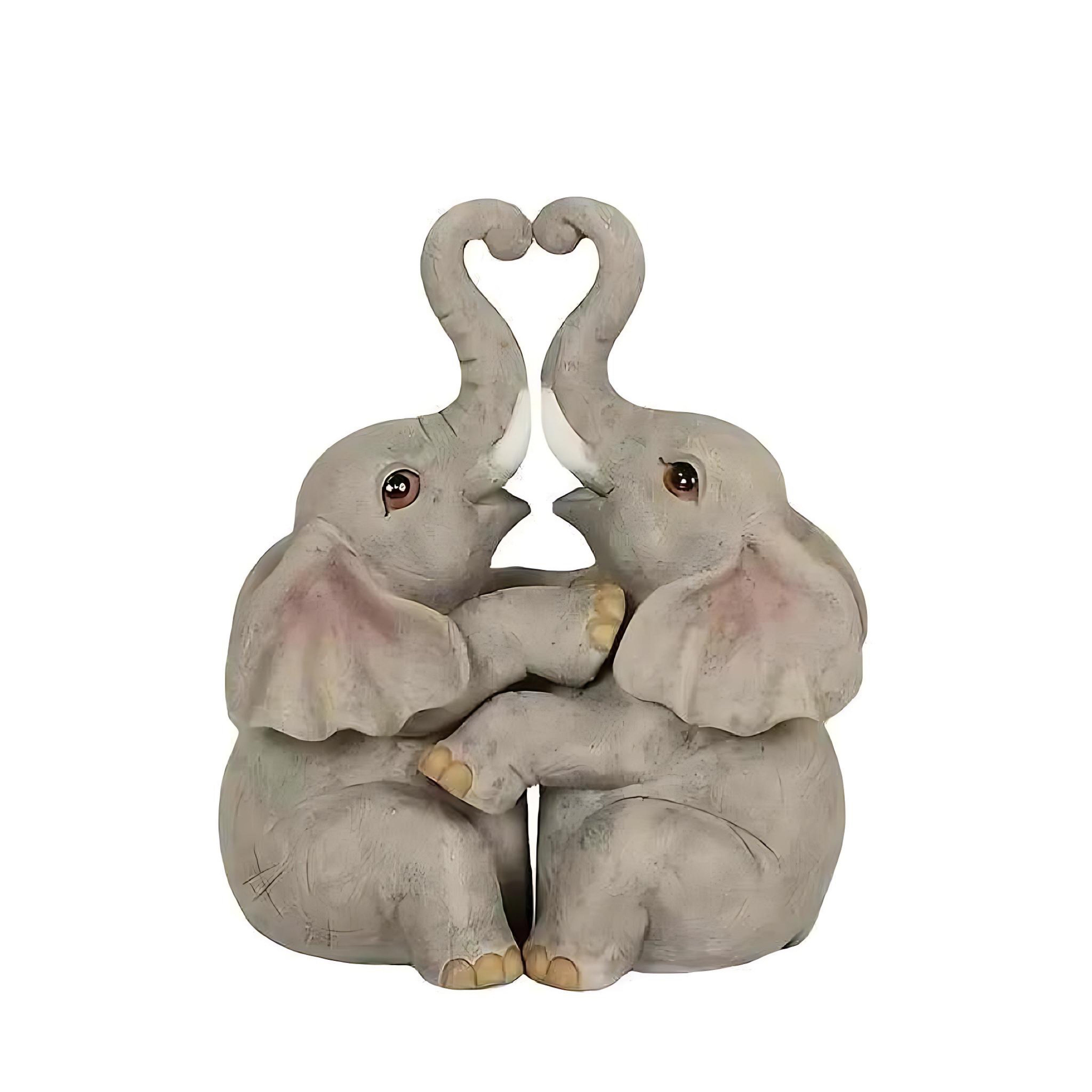 Resin elephant couple figurine with trunks forming a heart, shown on a clean white background.