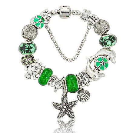 Ocean Series Green Glass Bead Bracelet – Dolphin, Shell & Starfish Charms